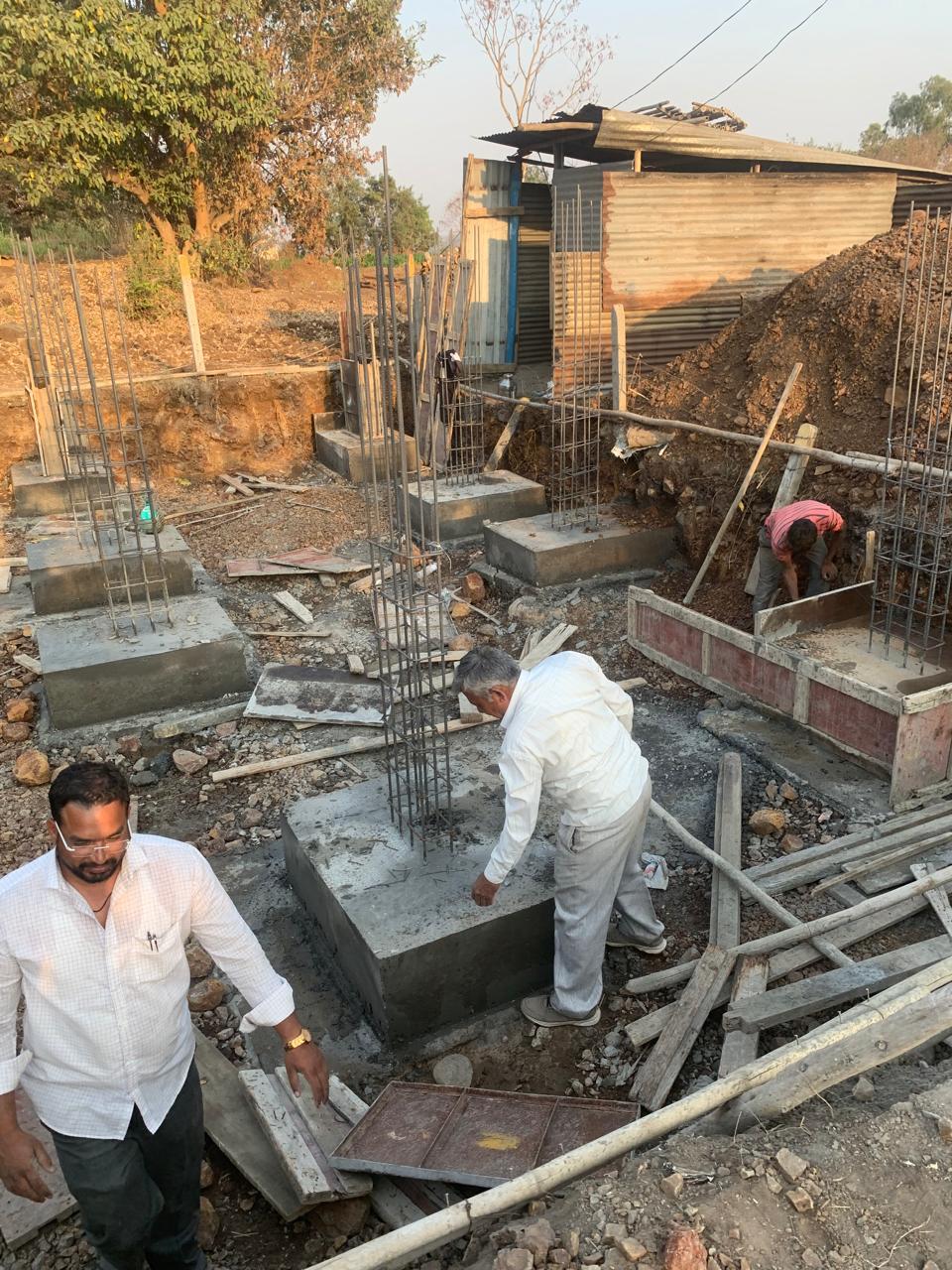 Construction workers on foundation site